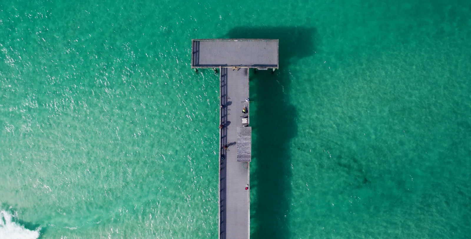 Top-down aerial of fishing pier